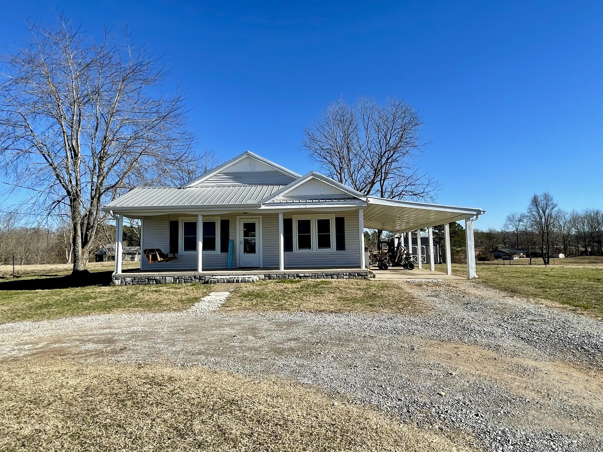 968 West Point Road Lawrenceburg, TN 38464 - Photo 5 of 21 a front view of a house with a garden