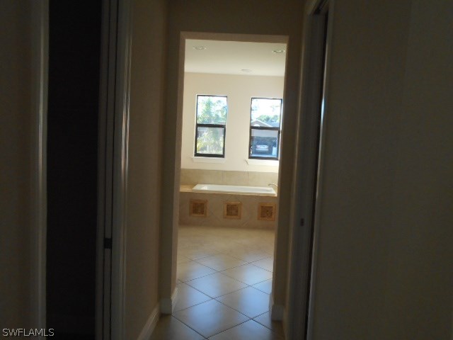 18225 Poplar Road Fort Myers, FL 33967 - Photo 14 of 21 a view of a bathroom from a hallway