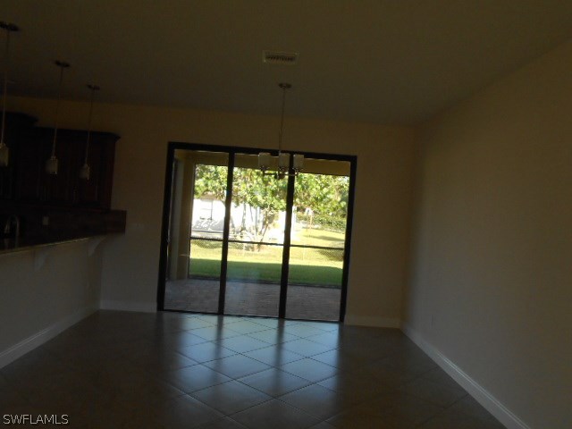 18225 Poplar Road Fort Myers, FL 33967 - Photo 16 of 21 a view of an empty room with glass door