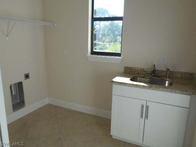 18225 Poplar Road Fort Myers, FL 33967 - Photo 20 of 21 a utility room with a sink dryer and washer