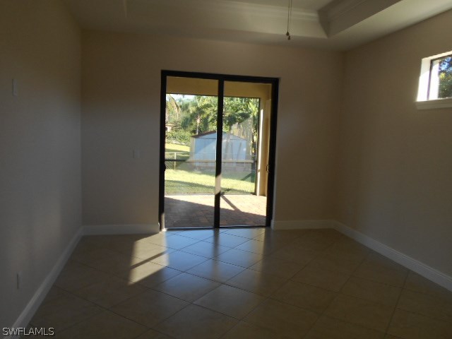 18225 Poplar Road Fort Myers, FL 33967 - Photo 6 of 21 wooden floor in an empty room with a window