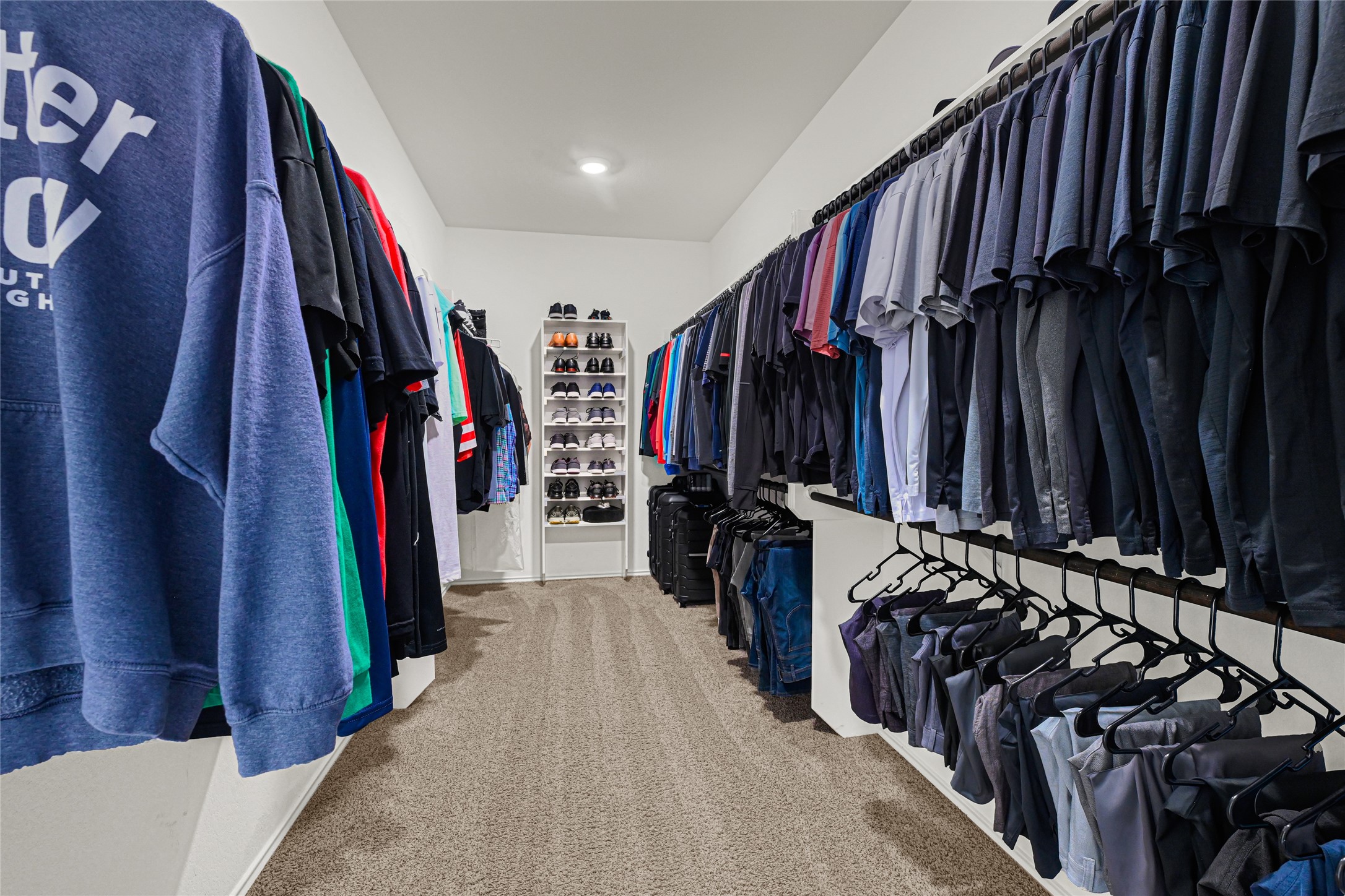 24303 Ravenna Landing Loop Spring, TX 77389 - Photo 25 of 46 a view of walk in closet with clothes