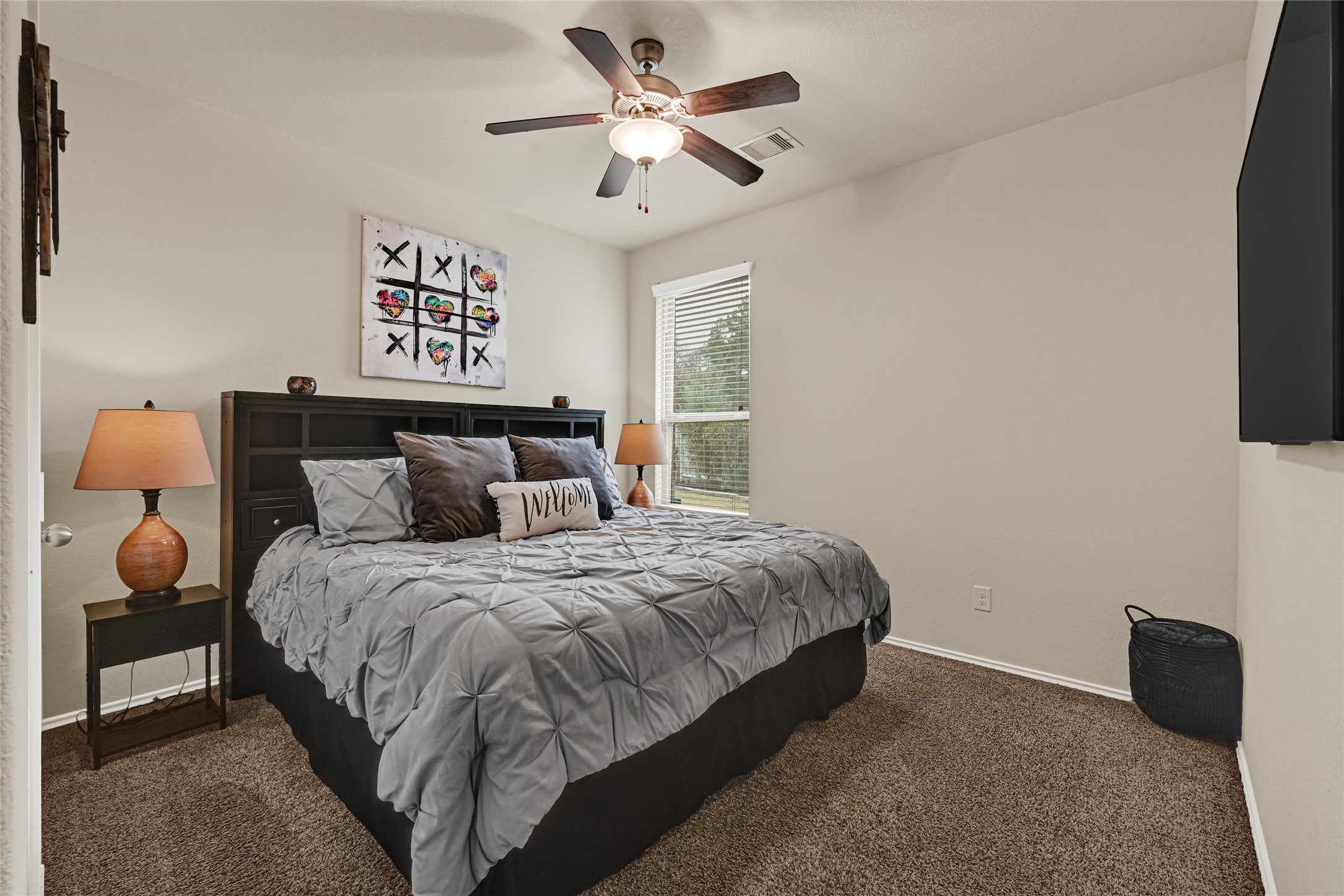 24303 Ravenna Landing Loop Spring, TX 77389 - Photo 28 of 46 a bedroom with bed and a chandelier