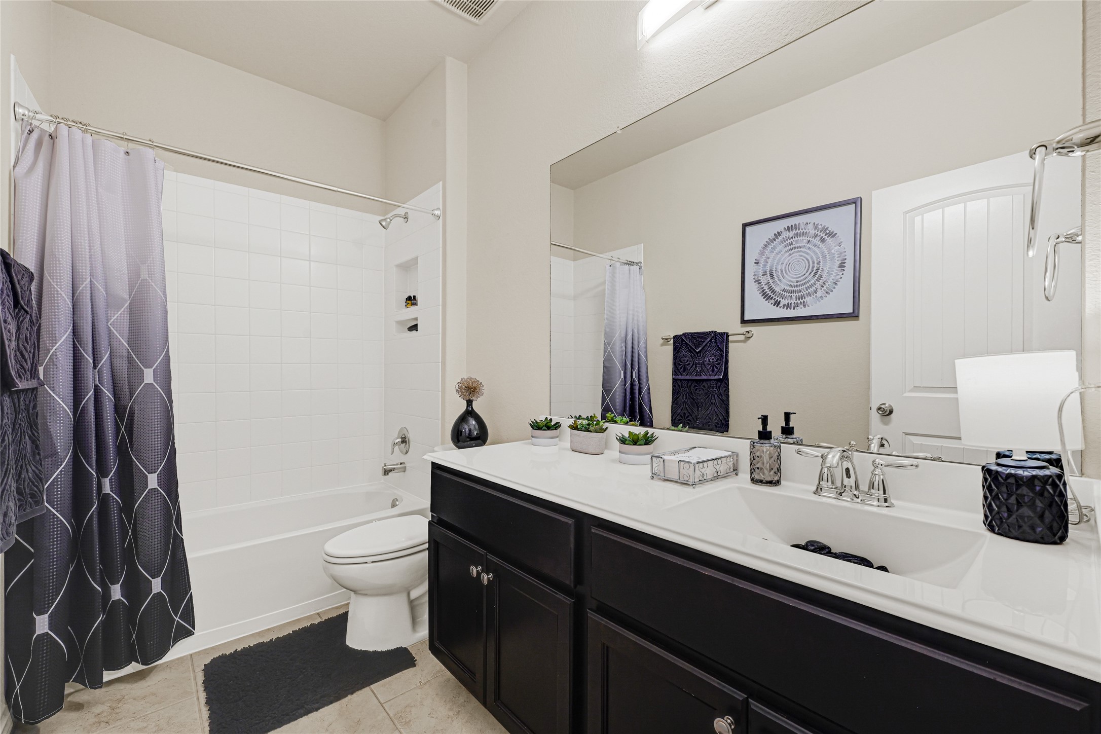 24303 Ravenna Landing Loop Spring, TX 77389 - Photo 30 of 46 a bathroom with a double vanity sink toilet and shower