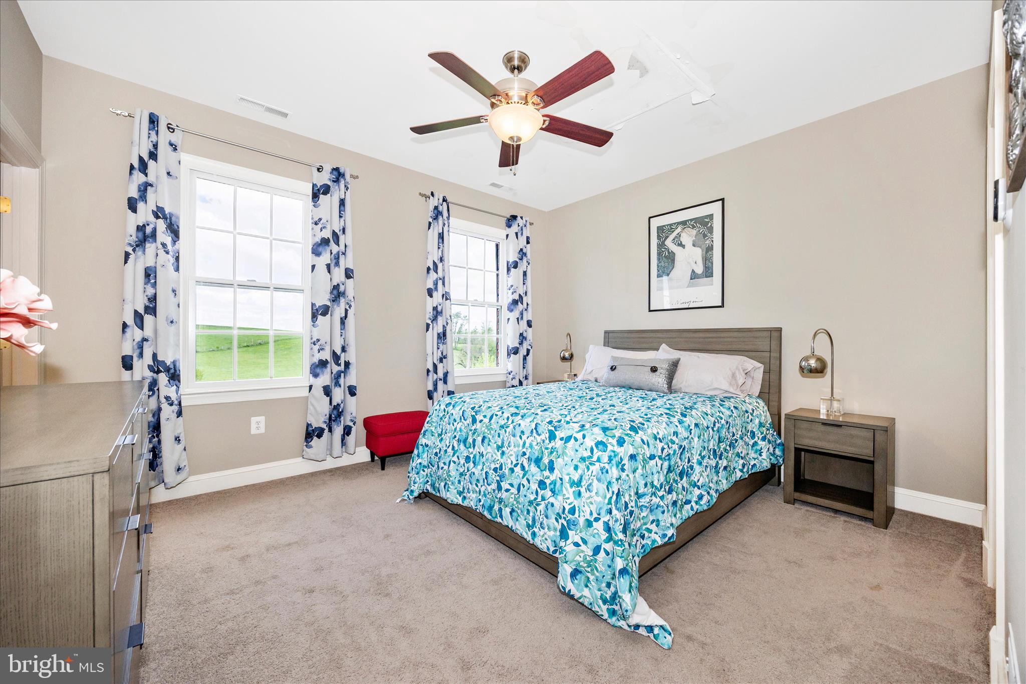 14746 New Windsor Road New Windsor, MD 21776 - Photo 32 of 67 a bedroom with a bed and a chandelier
