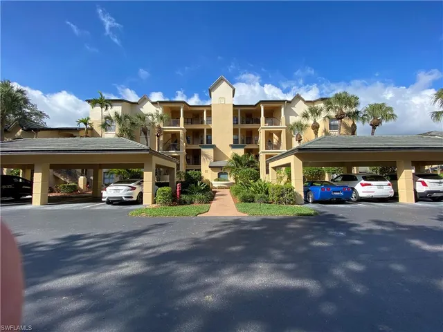 a front view of a building with parking