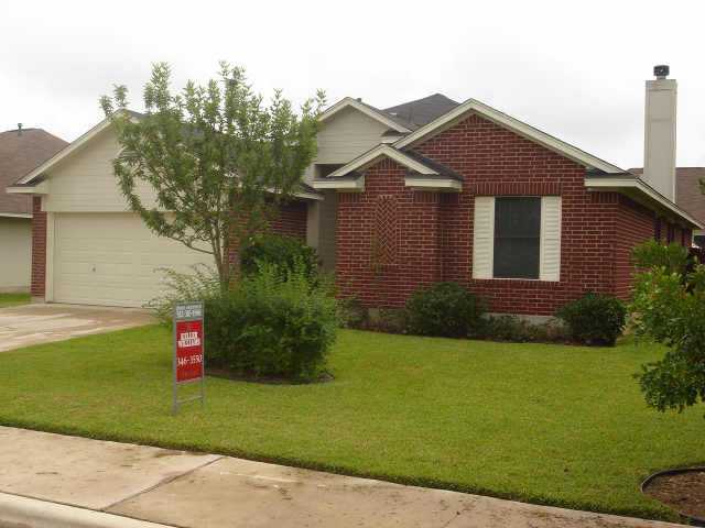 1600 Rio Bravo Loop Leander, TX 78641 - Photo 1 of 1 a front view of a house with a yard