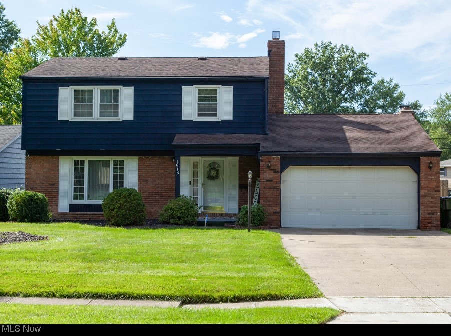 519 Button Road Bedford, OH 44146 - Photo 1 of 26 View of property with a front lawn and garage