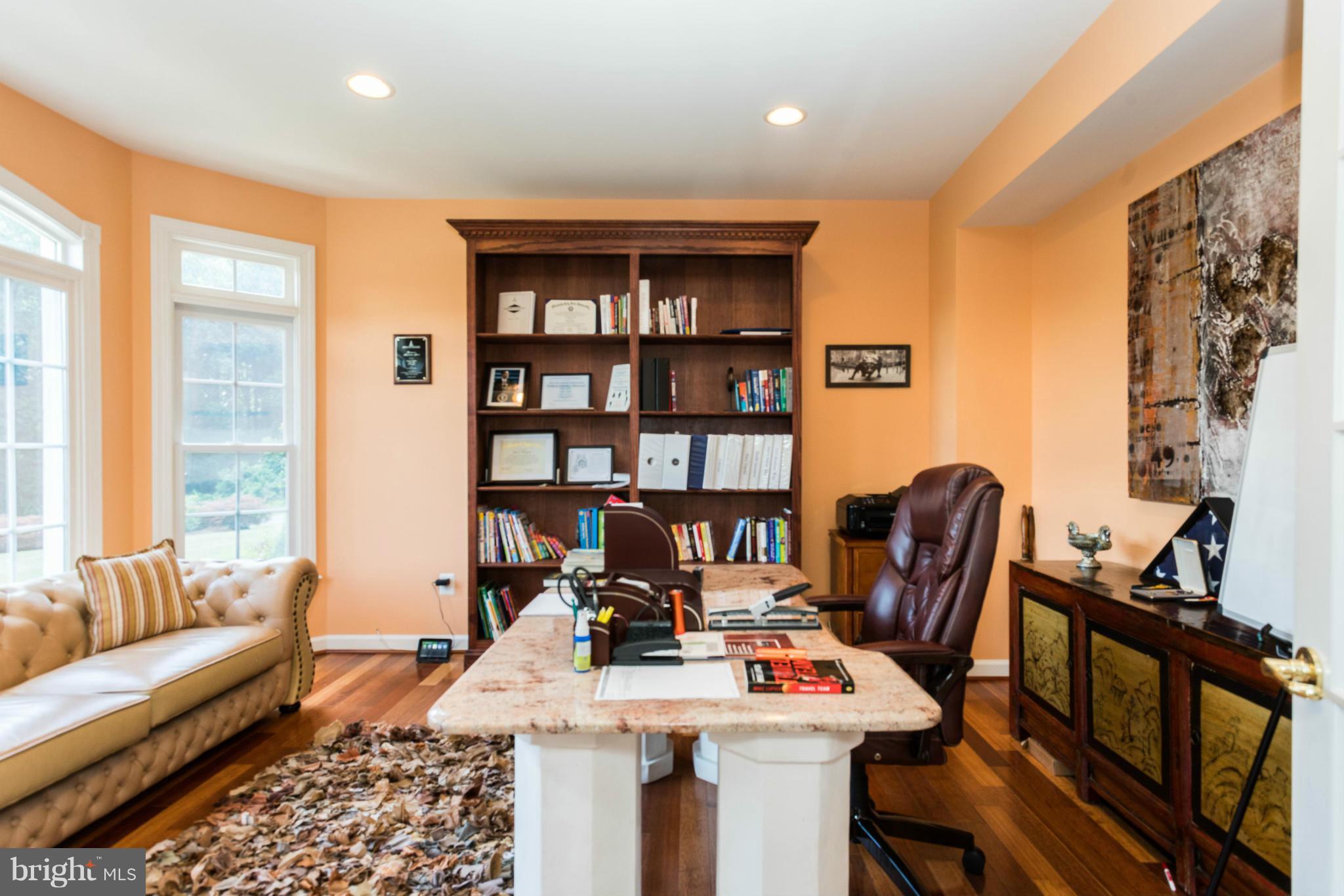 2302 Parlor Court Fallston, MD 21047 - Photo 14 of 30 a view of a workspace with furniture and a bookshelf