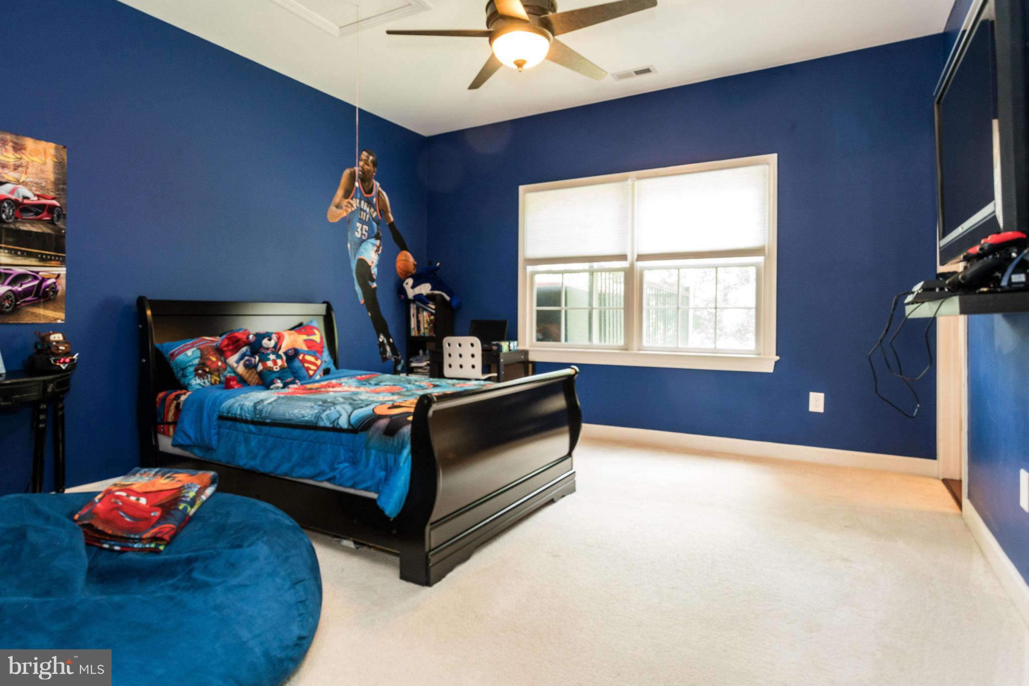2302 Parlor Court Fallston, MD 21047 - Photo 24 of 30 a bedroom with bed and a chandelier