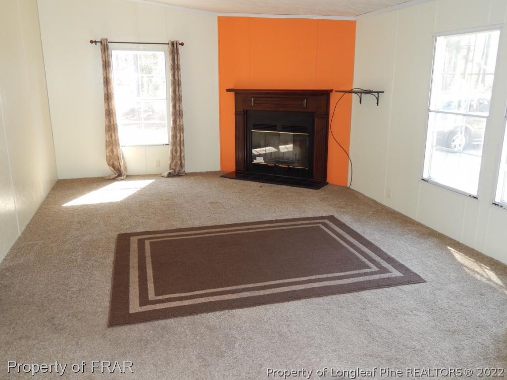 800 Pendergrass Road Raeford, NC 28376 - Photo 3 of 18 a living room with a fireplace