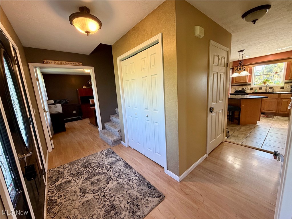 7374 Virginia Road Atwater, OH 44201 - Photo 4 of 49 Hall with light wood-style flooring and stairs