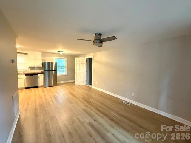 1450 3rd Street Southwest Hickory, NC 28602 - Photo 2 of 17 a view of a kitchen with a sink and a refrigerator