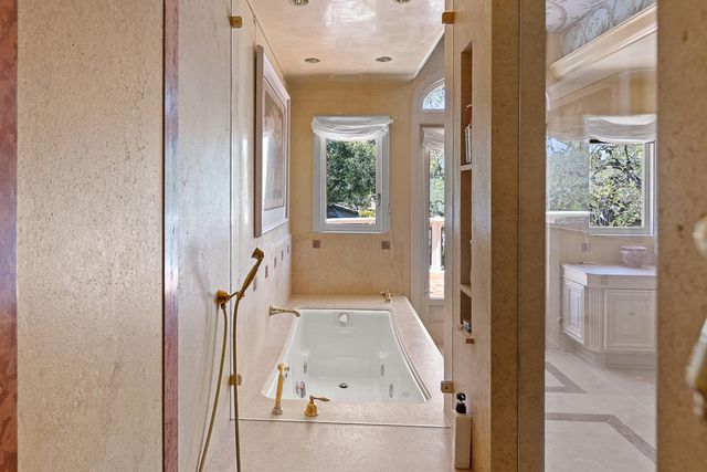 a bedroom with a large bed and a large window