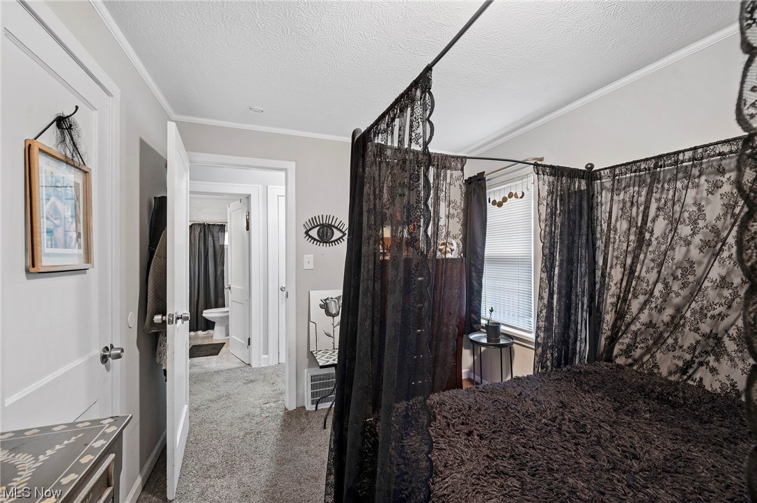 3305 Kildare Road Cleveland, OH 44118 - Photo 26 of 33 Carpeted bedroom featuring a textured ceiling and ornamental molding