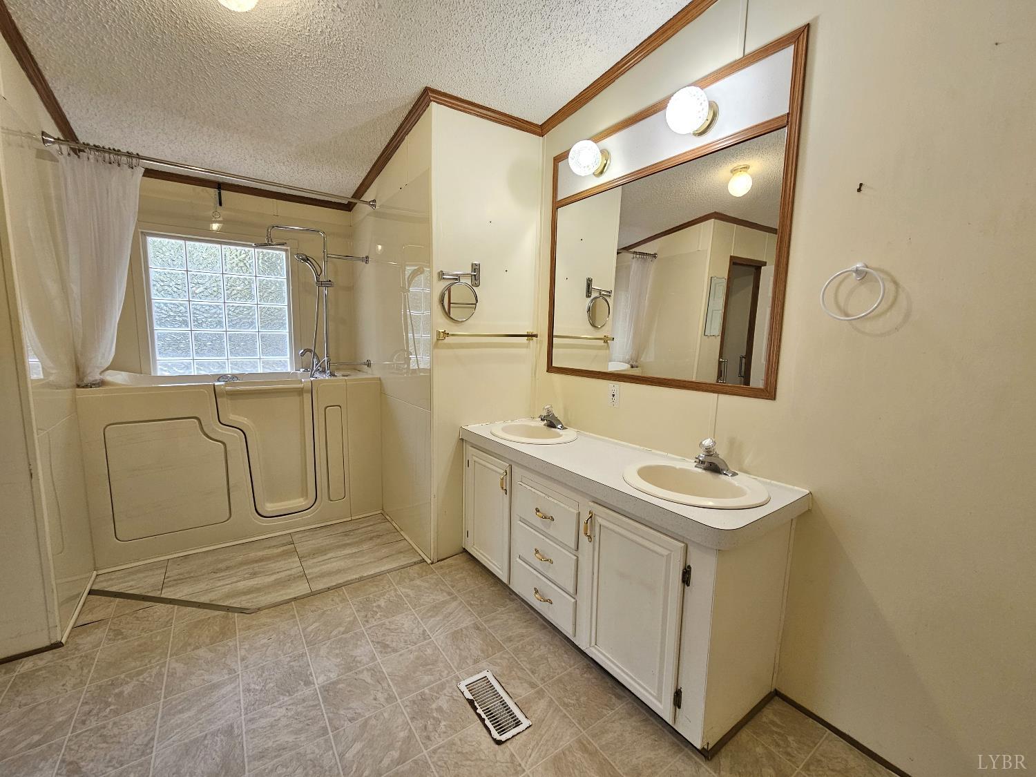 7962 Five Forks Road Farmville, VA 23901 - Photo 16 of 29 a bathroom with a double vanity sink mirror and