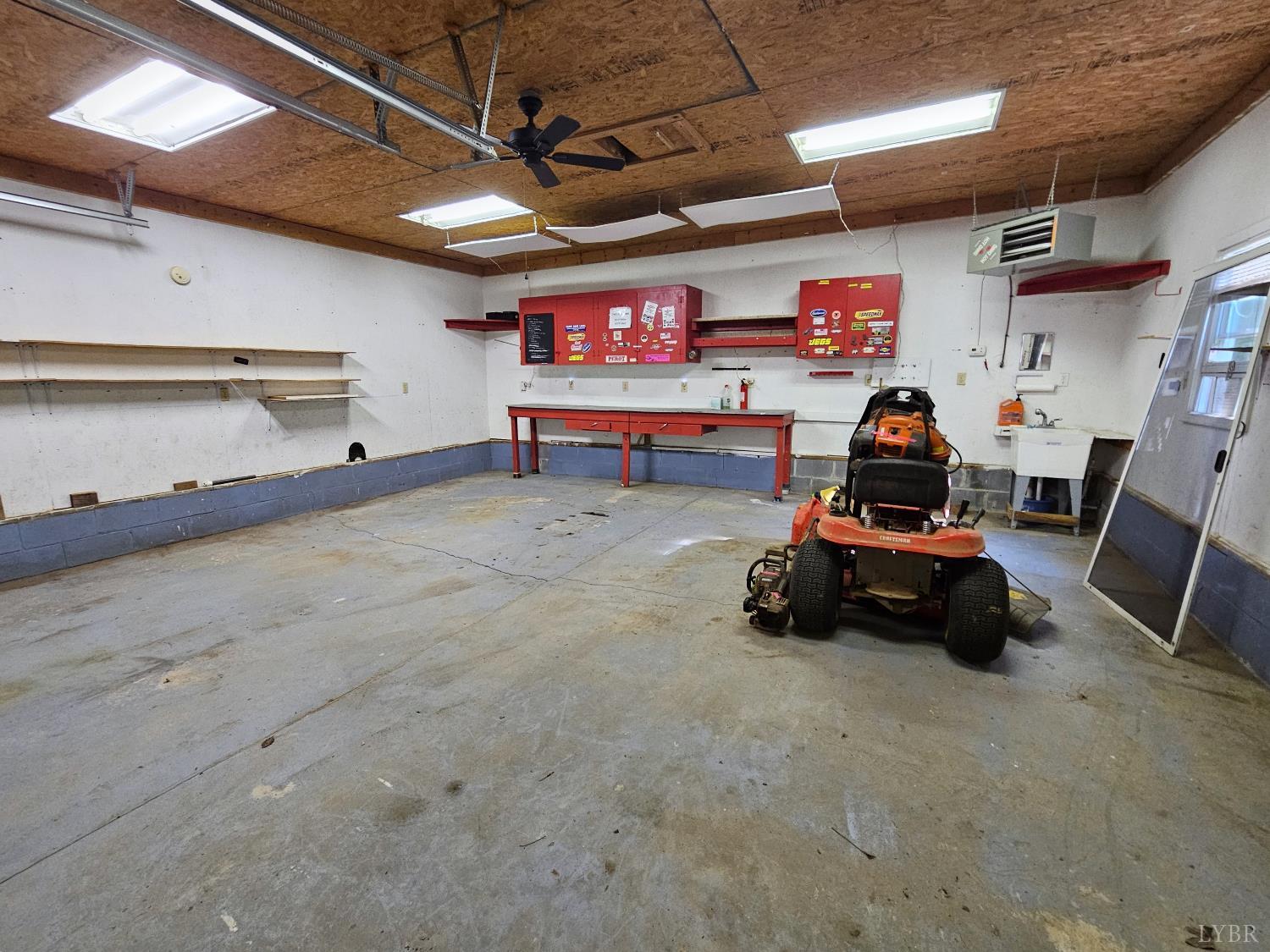 7962 Five Forks Road Farmville, VA 23901 - Photo 21 of 29 a car and bike in a garage