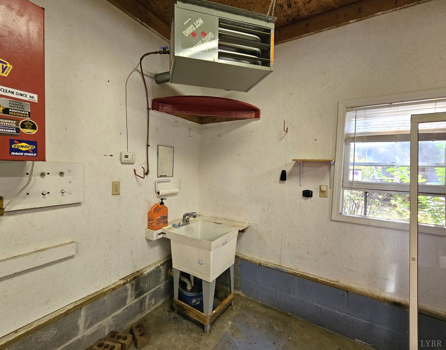 7962 Five Forks Road Farmville, VA 23901 - Photo 24 of 29 a utility room with cabinets washer and dryer