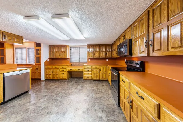 a kitchen with stainless steel appliances lots of counter top space