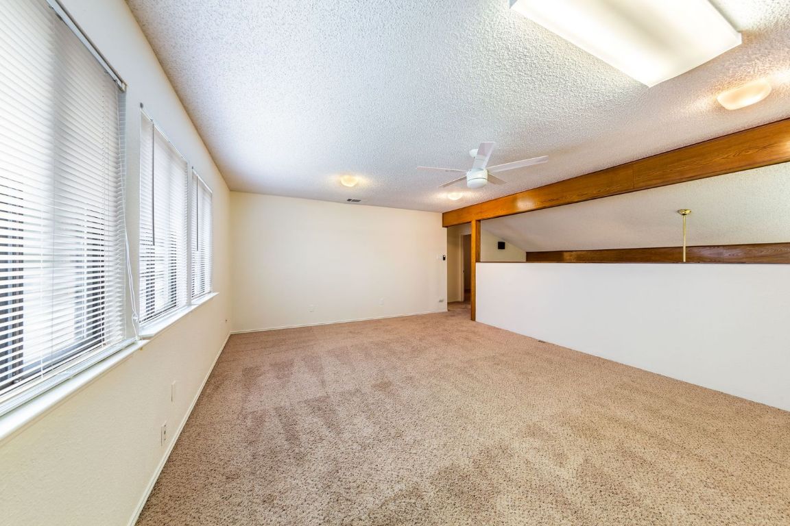 8501 Fathom Circle, Unit A Austin, TX 78750 - Photo 14 of 30 a view of an empty room and a window