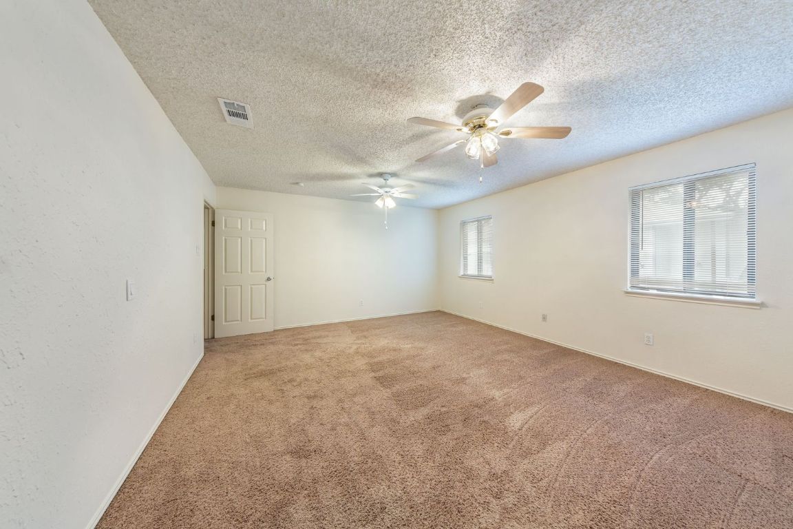 8501 Fathom Circle, Unit A Austin, TX 78750 - Photo 18 of 30 wooden floor in an empty room with a window