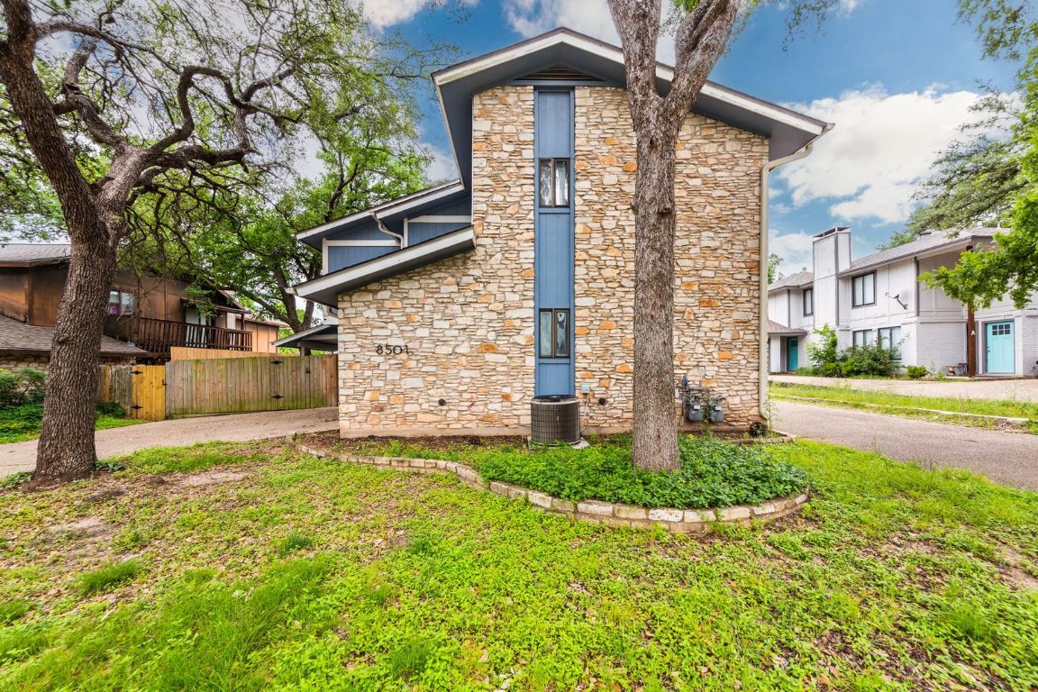 8501 Fathom Circle, Unit A Austin, TX 78750 - Photo 2 of 30 a front view of a house with a yard and garage
