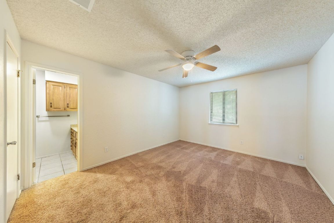 8501 Fathom Circle, Unit A Austin, TX 78750 - Photo 22 of 30 a view of an empty room with a window