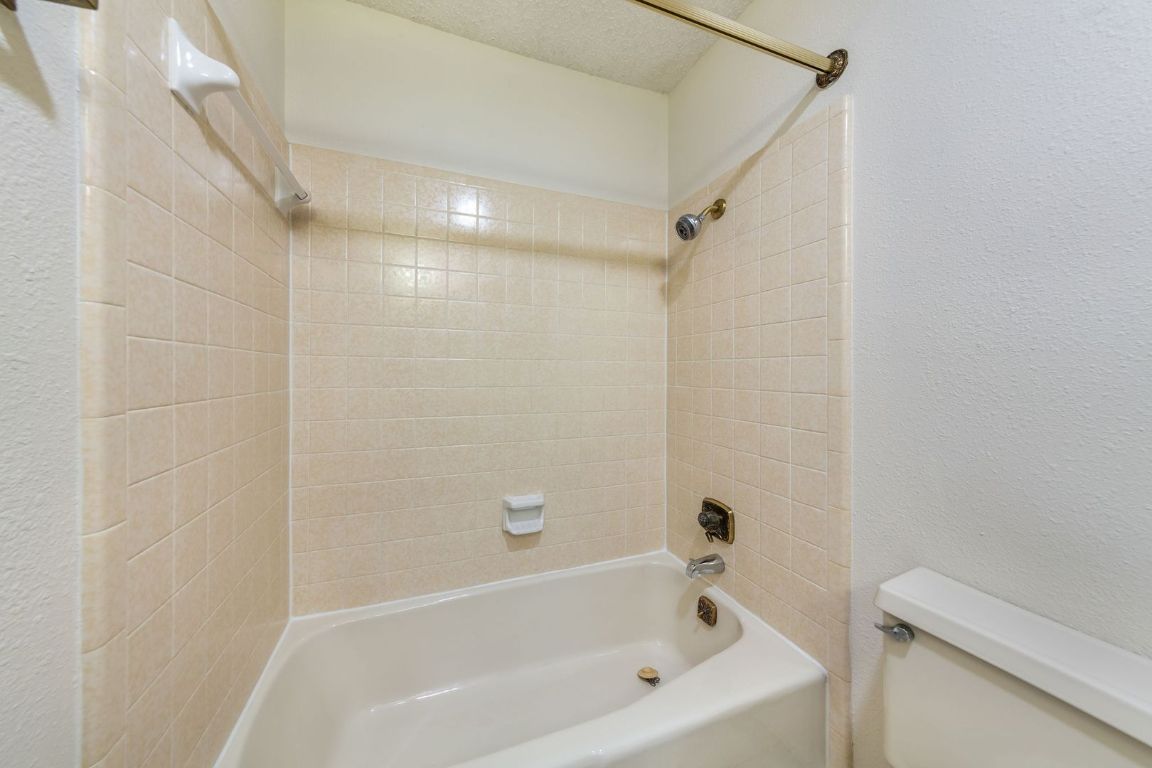 8501 Fathom Circle, Unit A Austin, TX 78750 - Photo 24 of 30 a bathroom with a bathtub