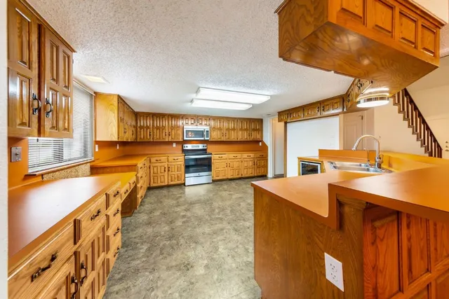 a view of a kitchen with furniture and a kitchen