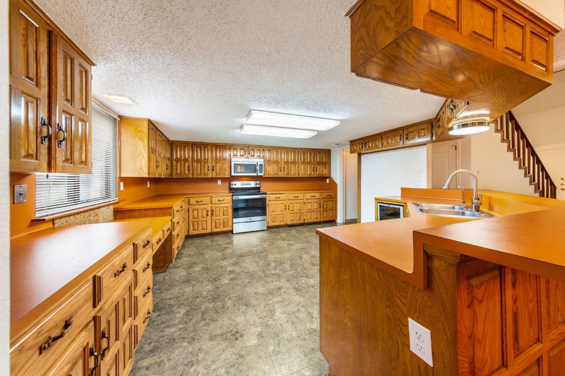8501 Fathom Circle, Unit A Austin, TX 78750 - Photo 9 of 30 a view of a kitchen with furniture and a kitchen
