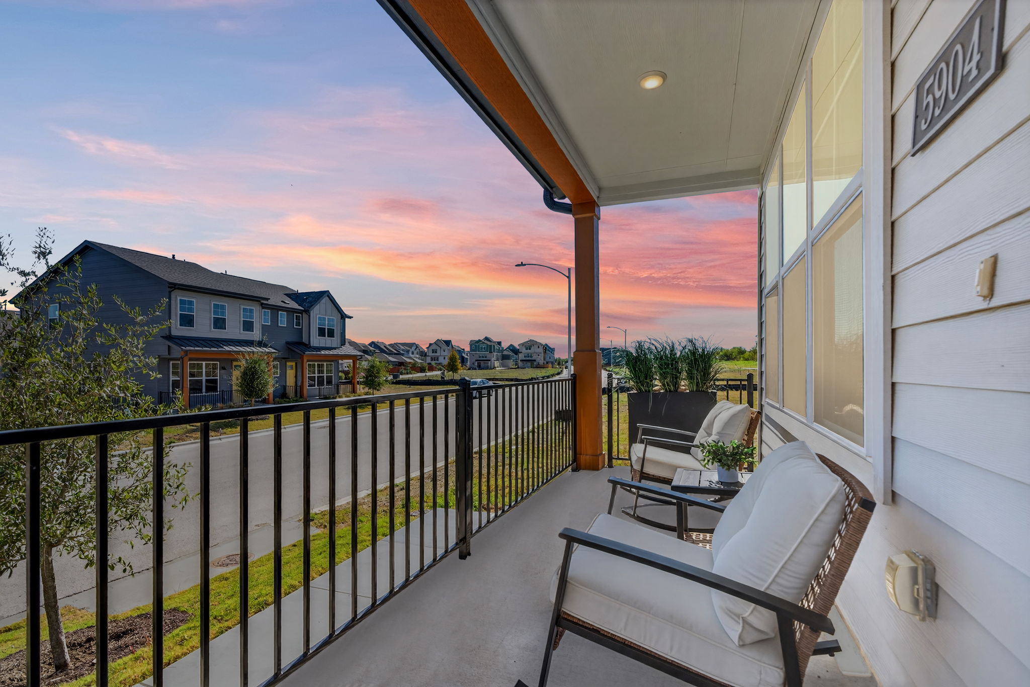 5904 Rotunda View Austin, TX 78747 - Photo 19 of 37 Balcony at dusk with a residential view