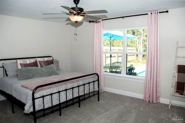 a en suite bathroom with double vanity and a two mirror