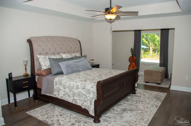 a view of a house with backyard porch and sitting area