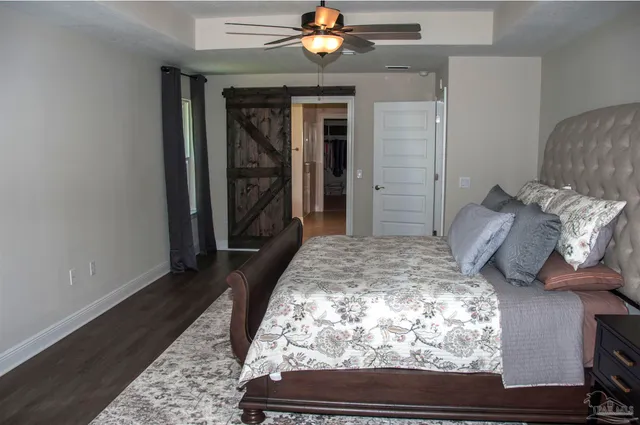 a view of pool with table and chairs under an umbrella