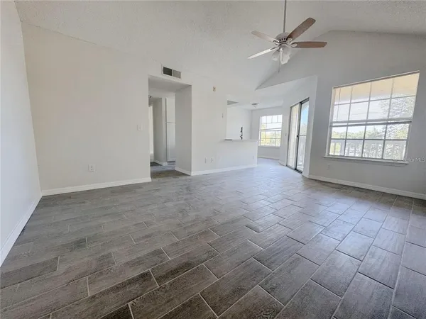 a view of an empty room with a window