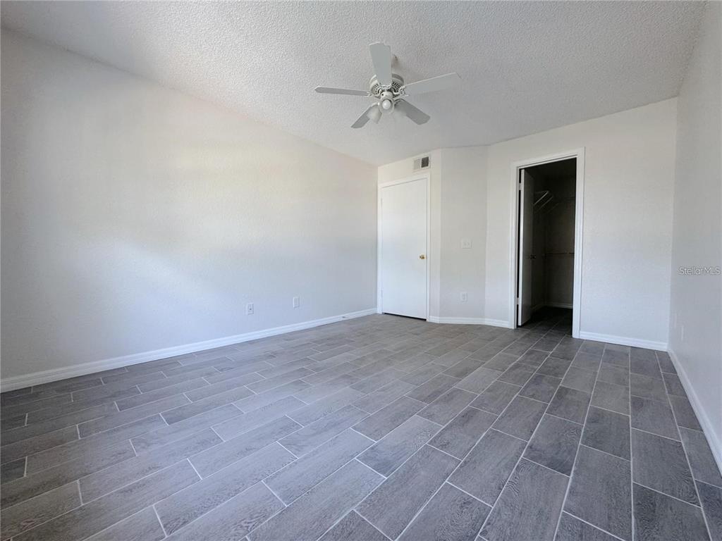 1013 South Hiawassee Road, Unit 3635 Orlando, FL 32835 - Photo 10 of 18 a view of an empty room with a ceiling fan
