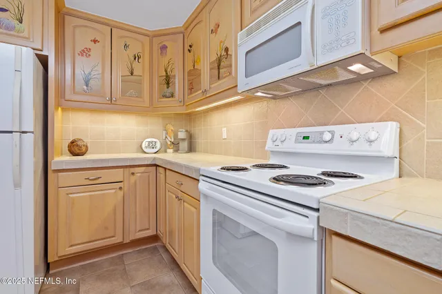 a bedroom with furniture and a flat screen tv