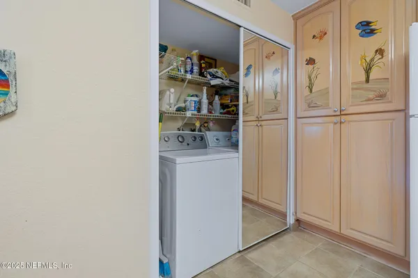 a bathroom with a granite countertop toilet a sink and a mirror