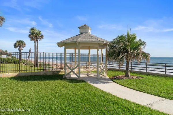 a view of a swimming pool with outdoor seating