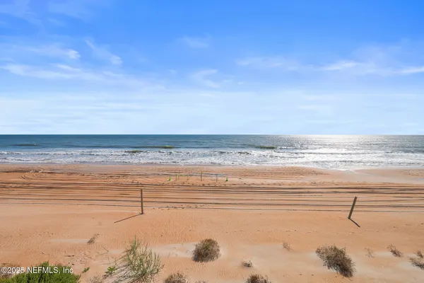 a view of a swimming pool with chairs