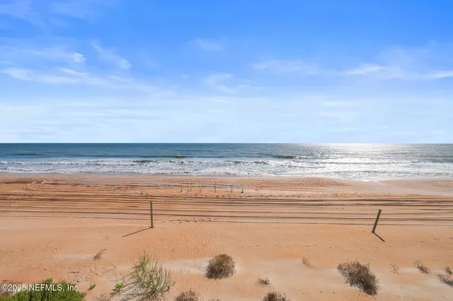 a view of a swimming pool with chairs
