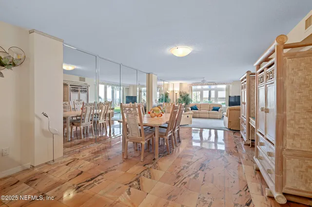 a view of a house with a yard and potted plants