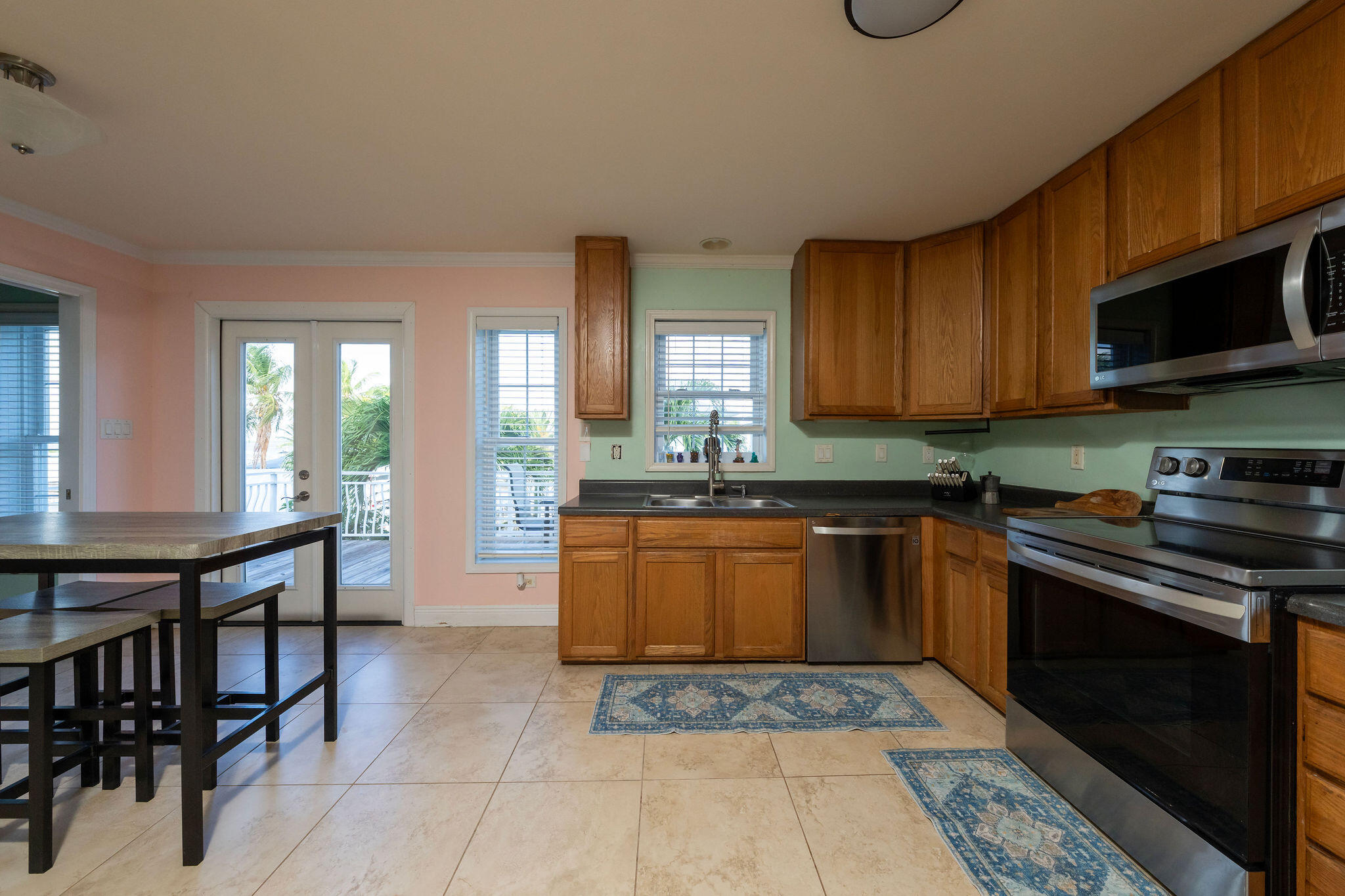 27 Avenue D Key Largo, FL 33037 - Photo 14 of 69 a kitchen with stainless steel appliances granite countertop a stove a sink dishwasher and cabinets