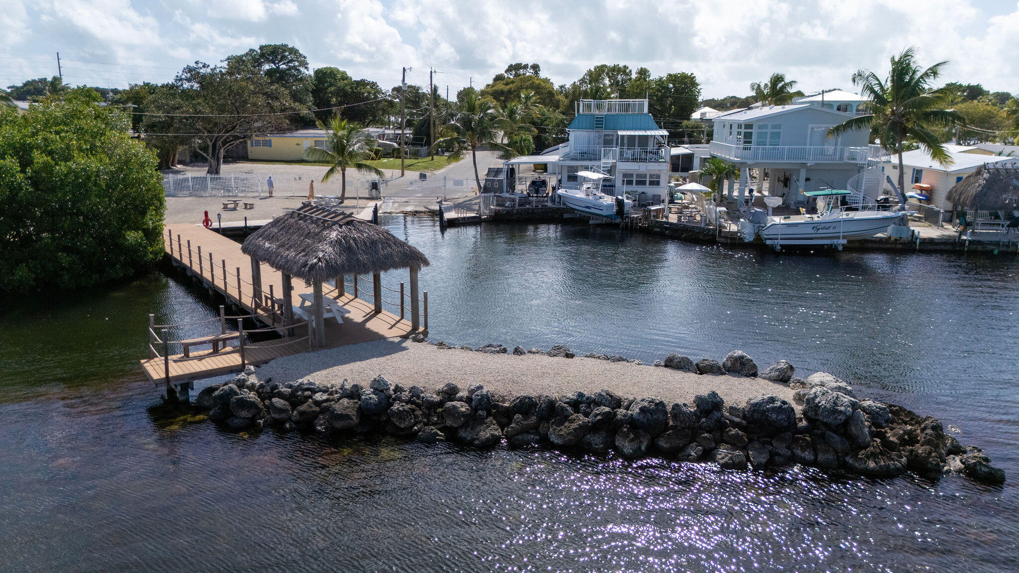 27 Avenue D Key Largo, FL 33037 - Photo 18 of 69 a view of a lake with boats and trees in the background