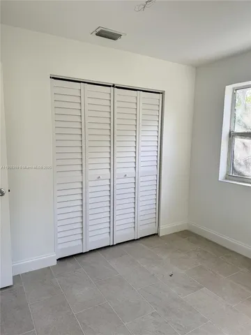 an empty room with closet