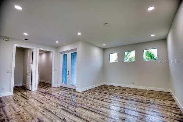 a kitchen with granite countertop a refrigerator stove and oven