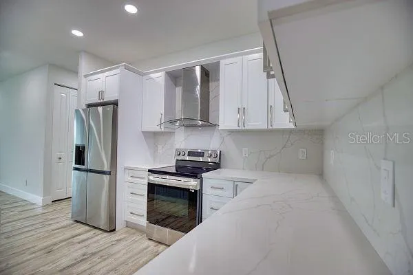 a view of kitchen with cabinets and wooden floor