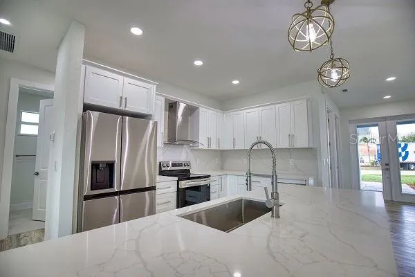 a view of kitchen and dining room with wooden floor