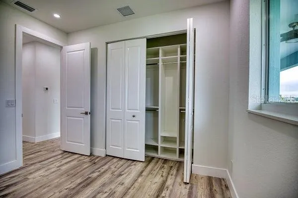 a bathroom with a double vanity sink mirror and shower