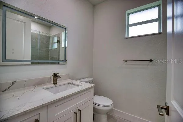 an aerial view of a house with garden